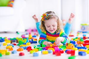 Girl playing Lego